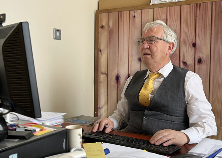 John M Shanahan Accountant at his desk